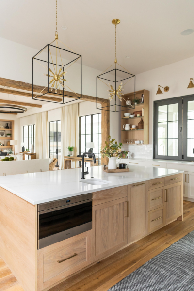 Luxury kitchen with wood accents and white countertops in a Charleston, SC custom home.